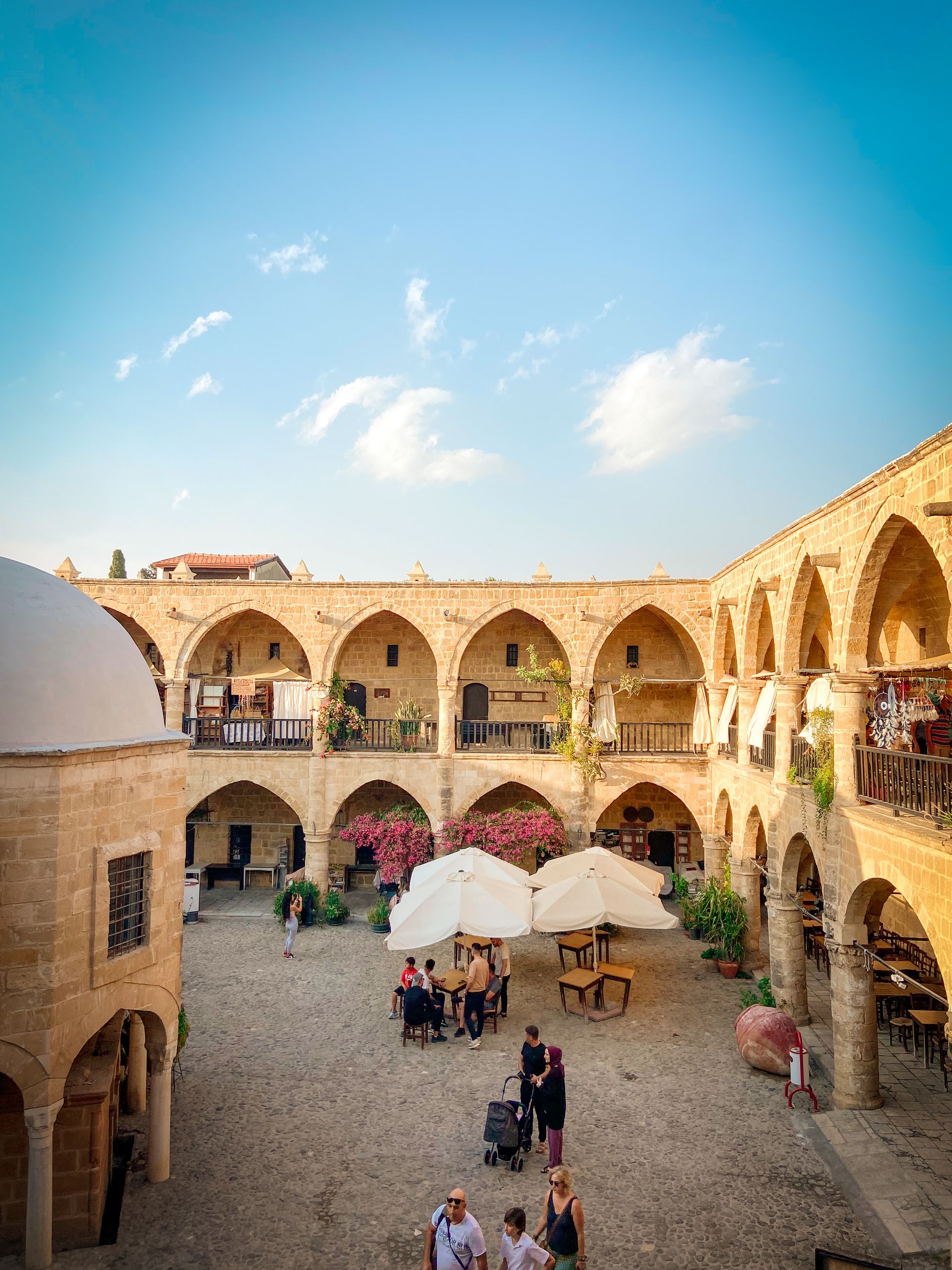 PGD and IVF 3 Explore the bustling courtyard of the iconic Buyuk Han, a landmark in Nicosia showcasing Ottoman architecture.